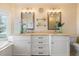 Bright bathroom featuring a double vanity and plenty of storage at 644 Boca Ciega Isle Dr, St Pete Beach, FL 33706