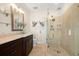 Bathroom with walk-in shower and dark brown vanity at 644 Boca Ciega Isle Dr, St Pete Beach, FL 33706