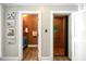 Hallway with powder room and private elevator access at 644 Boca Ciega Isle Dr, St Pete Beach, FL 33706