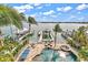 Private backyard oasis with pool, spa, and dock at 644 Boca Ciega Isle Dr, St Pete Beach, FL 33706