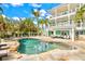 Stunning home with a freeform pool and expansive patio at 644 Boca Ciega Isle Dr, St Pete Beach, FL 33706