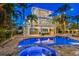 Stunning pool and patio area with a hot tub, perfect for entertaining at 644 Boca Ciega Isle Dr, St Pete Beach, FL 33706