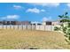 Large backyard with privacy fence and grass at 6834 Blue Moon Way, Sun City Center, FL 33573