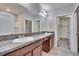 Double vanity bathroom with granite countertop at 6834 Blue Moon Way, Sun City Center, FL 33573