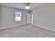 Bright bedroom with neutral walls and carpeted floors at 6834 Blue Moon Way, Sun City Center, FL 33573