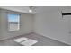 Well-lit bedroom featuring window blinds and carpet flooring at 6834 Blue Moon Way, Sun City Center, FL 33573