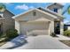 Two-story house with attached garage and landscaping at 6834 Blue Moon Way, Sun City Center, FL 33573