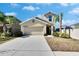 Two-story house exterior with attached garage at 6834 Blue Moon Way, Sun City Center, FL 33573