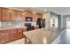 Open kitchen boasting granite countertops and stainless steel appliances at 6834 Blue Moon Way, Sun City Center, FL 33573