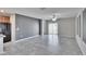 Bright living room with tile floors and sliding glass doors at 6834 Blue Moon Way, Sun City Center, FL 33573