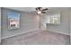 Spacious loft area with carpet and ceiling fan at 6834 Blue Moon Way, Sun City Center, FL 33573