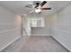 Bright loft bedroom with window and ceiling fan at 6834 Blue Moon Way, Sun City Center, FL 33573