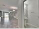 Small powder room with pedestal sink and tiled floor at 6834 Blue Moon Way, Sun City Center, FL 33573