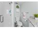 Modern bathroom with a walk-in shower and white tile at 6950 113Th St, Seminole, FL 33772