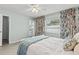 Light and airy bedroom with a comfortable bed and en-suite bathroom at 6950 113Th St, Seminole, FL 33772