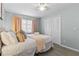 Serene bedroom with a queen bed and neutral decor at 6950 113Th St, Seminole, FL 33772