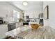 Modern kitchen island with granite countertop, view to dining area at 701 Poinsettia Rd # 302, Belleair, FL 33756