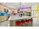 Modern kitchen with white cabinets and a large island at 711 Eagle Ln, Apollo Beach, FL 33572