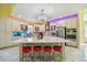 Modern kitchen with white cabinets, marble island, and stainless steel appliances at 711 Eagle Ln, Apollo Beach, FL 33572