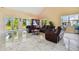 Spacious living room with leather furniture and marble floors at 711 Eagle Ln, Apollo Beach, FL 33572