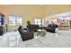 Spacious living room with leather furniture and marble floors at 711 Eagle Ln, Apollo Beach, FL 33572