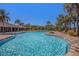 Resort-style pool with a large deck and shaded seating areas at 7395 Steer Blade Dr, Zephyrhills, FL 33541