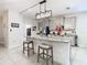 Kitchen island with granite countertops and gray cabinets at 7395 Steer Blade Dr, Zephyrhills, FL 33541