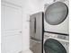 Convenient laundry room with a new washer, dryer, and refrigerator at 7395 Steer Blade Dr, Zephyrhills, FL 33541