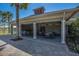 Covered patio with tables and chairs near the pool at 7395 Steer Blade Dr, Zephyrhills, FL 33541