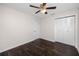 Bedroom with double door closet and dark laminate flooring at 7449 16Th N St, St Petersburg, FL 33702