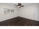 Bedroom with ceiling fan and dark laminate flooring at 7449 16Th N St, St Petersburg, FL 33702