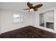 Spacious living room with dark hardwood floors and sliding doors at 7449 16Th N St, St Petersburg, FL 33702