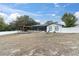 Backyard view showing a pergola and screened patio at 8237 Delaware Dr, Weeki Wachee, FL 34607