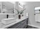 Modern bathroom with double sinks and marble countertops at 8237 Delaware Dr, Weeki Wachee, FL 34607