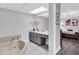 Bathroom featuring a soaking tub and a double vanity at 8237 Delaware Dr, Weeki Wachee, FL 34607