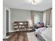 Bedroom with a bookcase and an oval stained-glass window at 8237 Delaware Dr, Weeki Wachee, FL 34607