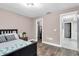 Bedroom with a queen-size bed and access to a large closet at 8237 Delaware Dr, Weeki Wachee, FL 34607