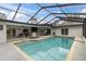 Screened pool and patio area with a large pool and outdoor bar at 8237 Delaware Dr, Weeki Wachee, FL 34607