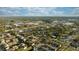 Wide aerial view of townhome community near city skyline at 8615 Carroll Oaks Dr, Tampa, FL 33614