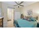 Bedroom with queen bed, dresser, and access to bathroom and closet at 8615 Carroll Oaks Dr, Tampa, FL 33614