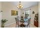 Cozy dining area with glass table and four chairs at 8615 Carroll Oaks Dr, Tampa, FL 33614