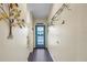 Interior entryway with teal door and hardwood floor at 8615 Carroll Oaks Dr, Tampa, FL 33614