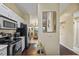 View of kitchen, granite counters, and living room at 8615 Carroll Oaks Dr, Tampa, FL 33614