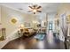 Open living room features hardwood floors and a view into the kitchen at 8615 Carroll Oaks Dr, Tampa, FL 33614