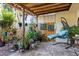 Covered patio with hanging chair and potted plants at 8615 Carroll Oaks Dr, Tampa, FL 33614