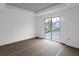 Unfinished bedroom with sliding glass doors leading to the outdoors at 9057 Bantry Bay Blvd, Englewood, FL 34224