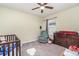 Bright bedroom with ceiling fan, window, and ample space for furniture at 9215 Royal River Cir, Parrish, FL 34219