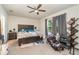 Spacious main bedroom with a large bed, ceiling fan, and plenty of natural light at 9215 Royal River Cir, Parrish, FL 34219