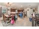 Open concept dining room with a wooden table and view into kitchen at 9215 Royal River Cir, Parrish, FL 34219