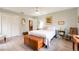 Serene bedroom with a double bed, built-in wooden storage chest and a view at 1018 Caravel Ct, Tarpon Springs, FL 34689